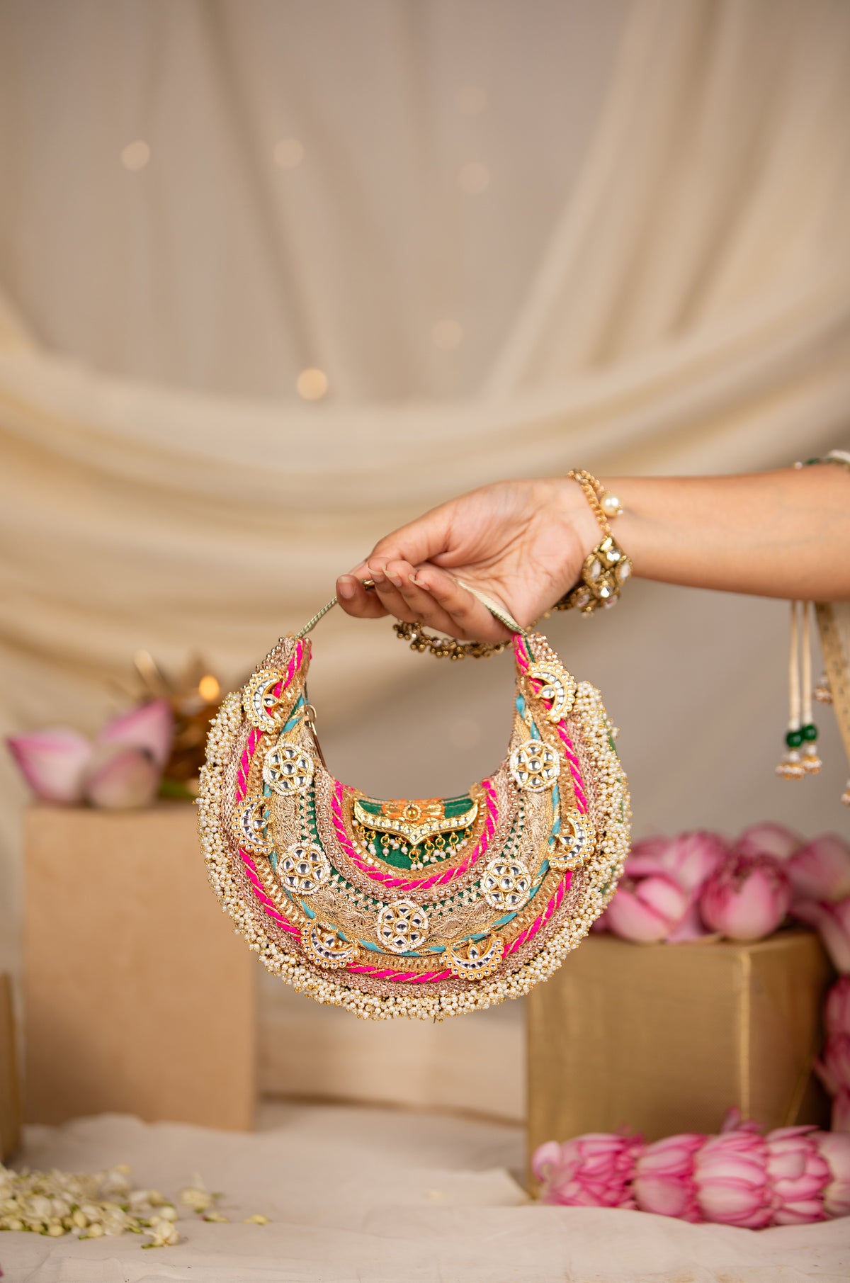 Pranika gold handbag with elegant detailing by 5 Elements