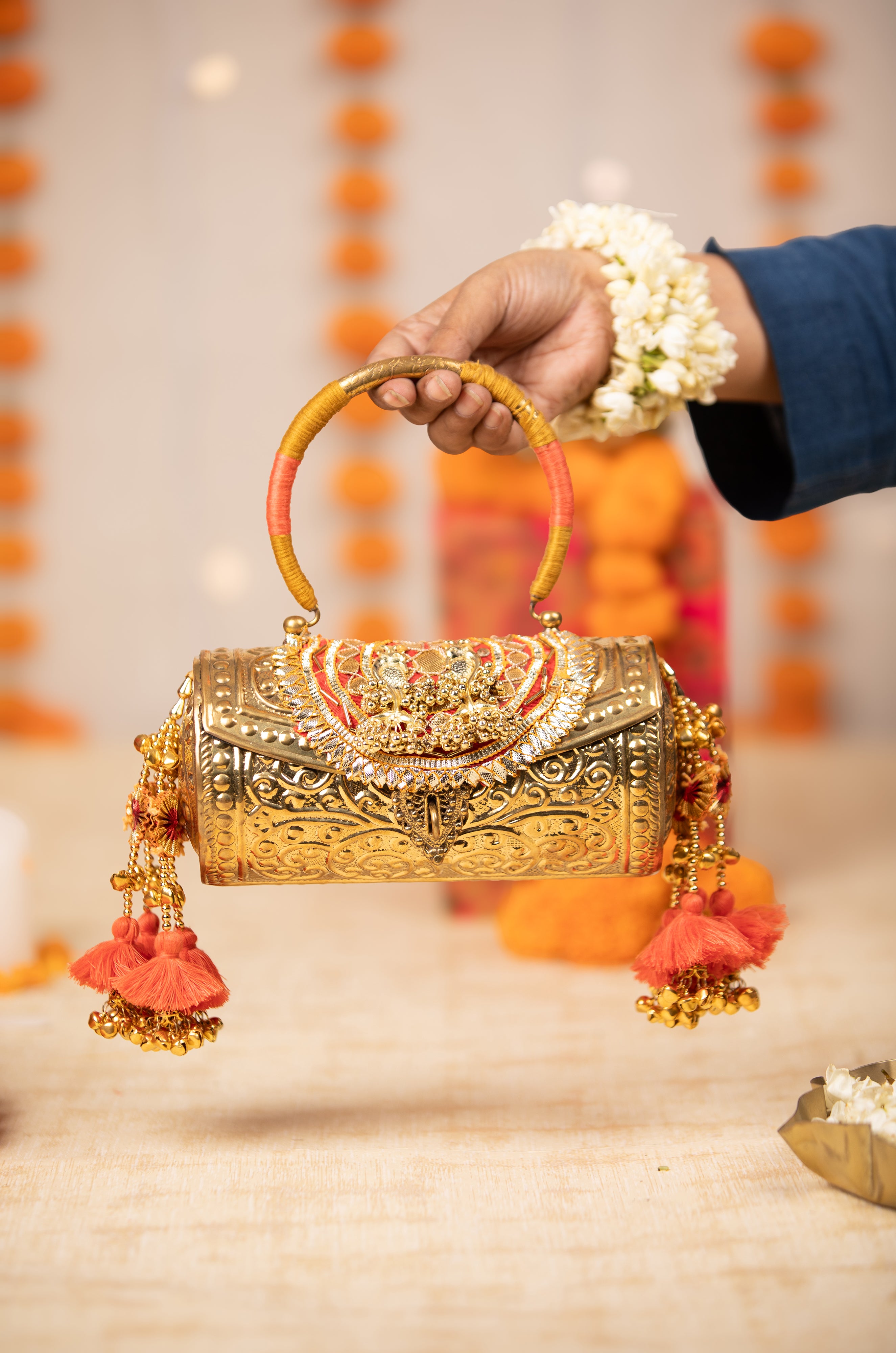 Tanvika Gold Handbag