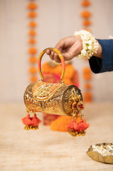 Tanvika Gold Handbag
