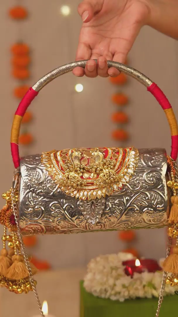 Tanvika Gold Handbag